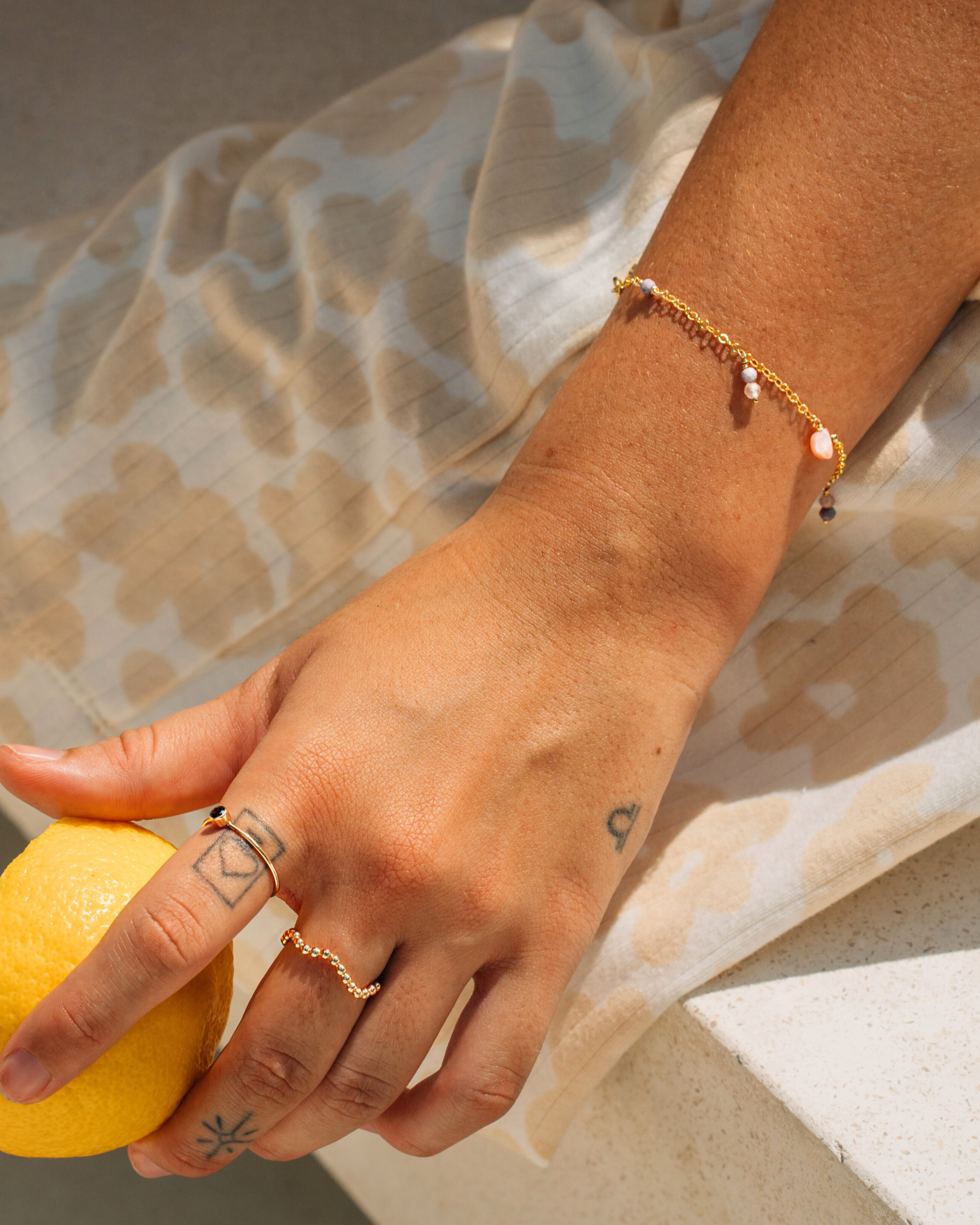 Fun summery charm gemstone bracelet with pink opal, lepidolite and rose quartz in 14k gold filled.