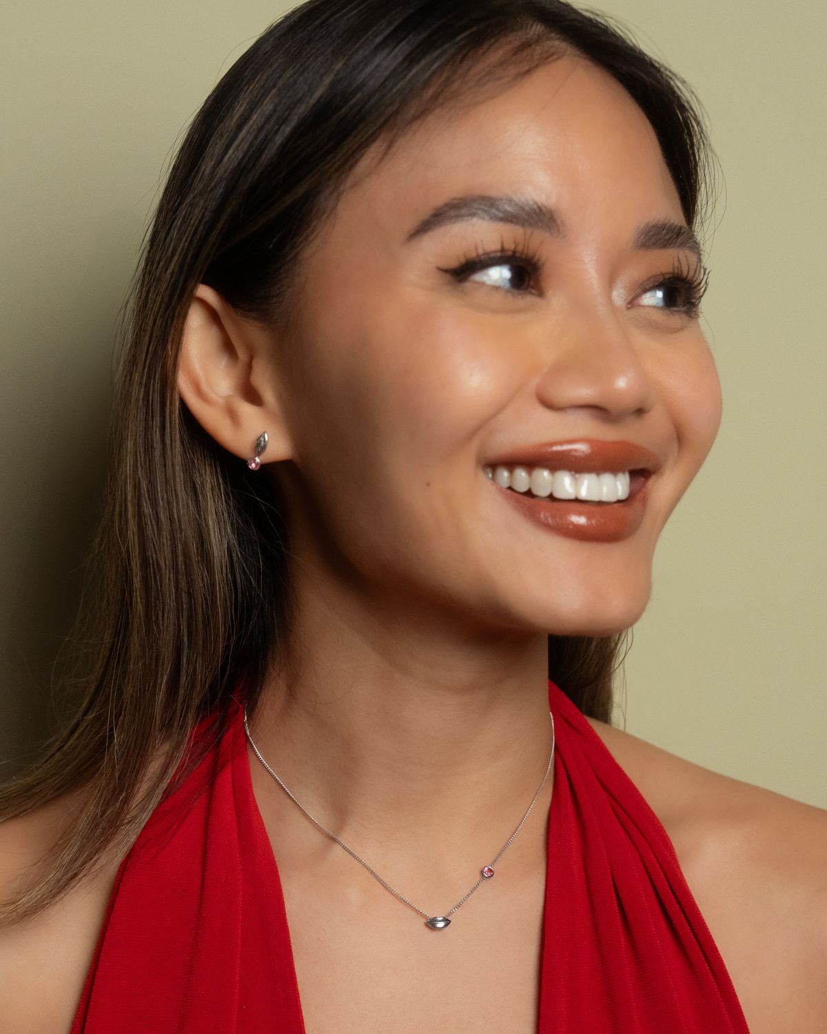 Model wearring Cherie Drop Earrings in a fun way. Pairing perfectly with the Amour Necklace