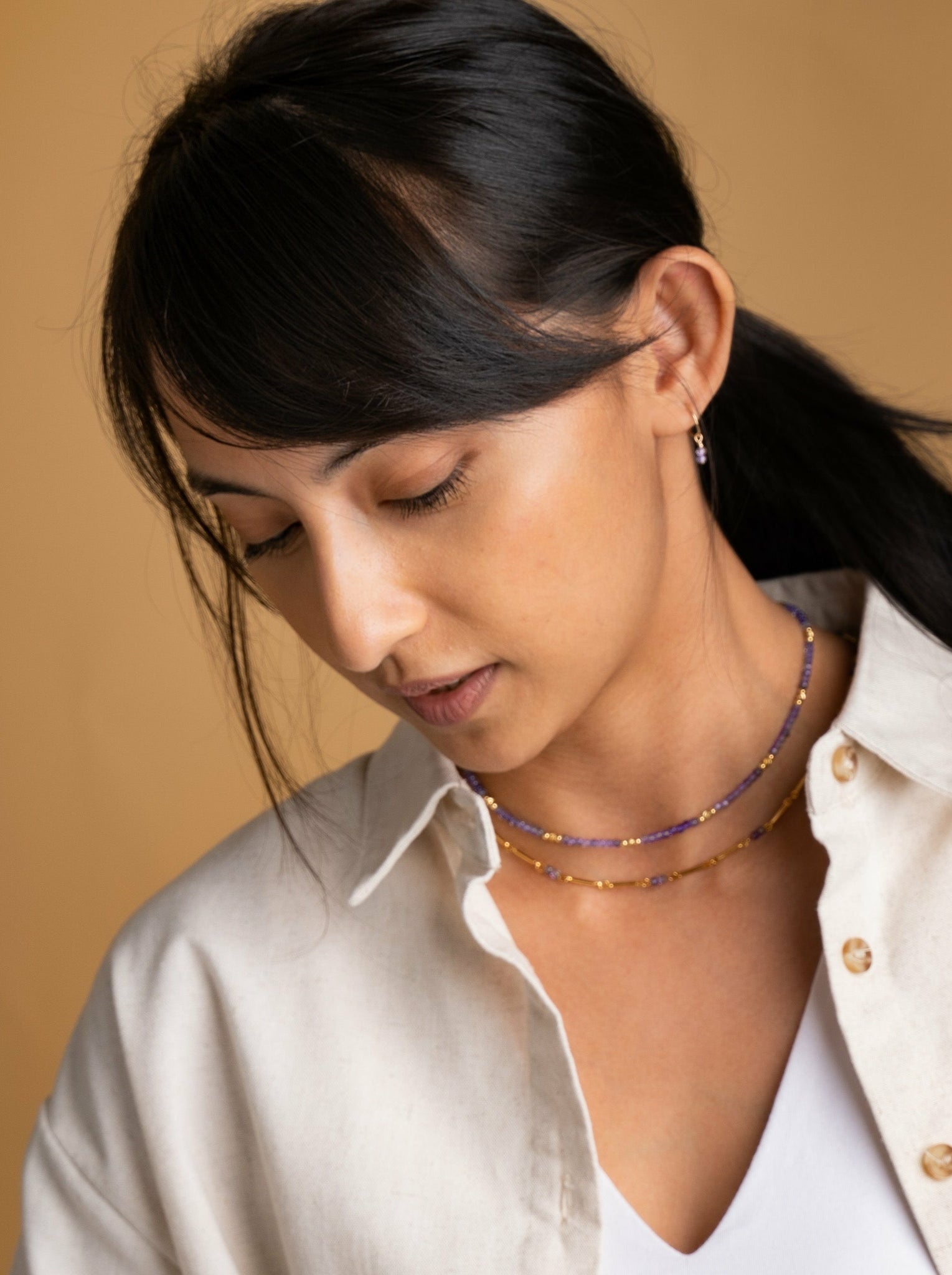 Model wearring gemstone choker necklace in Iolite 